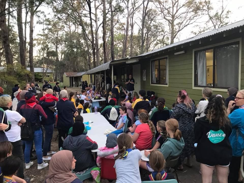 A large group gathered outside the hall at Glenfield Scout Activity Centre
