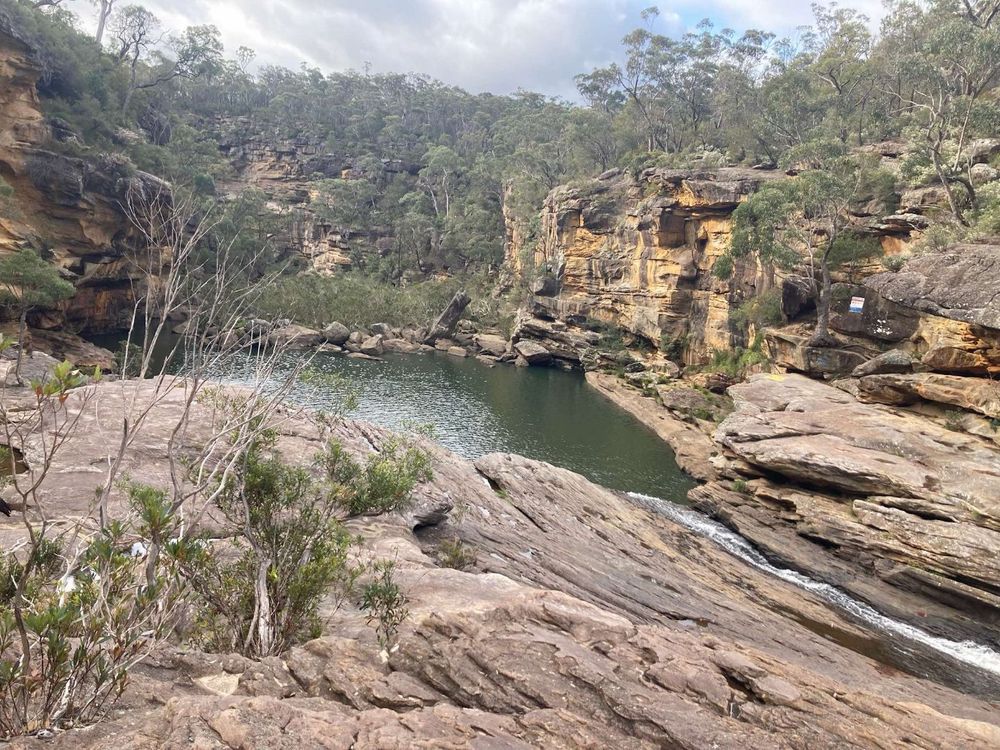 Sandstone gorge and waterhole surrounded by bushland at Warrabunda Scout Camp, Tahmoor